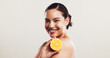 © KayExam/peopleimages.com - Orange, skincare and portrait of woman in studio with natural, organic and vitamin c face routine. Beauty, dermatology and female person with citrus fruit for facial brightening by white background.