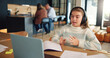 © peopleimages.com - Video call, talking and child in home on laptop for online learning, education and lesson on website. School, virtual class and young girl on computer and answer for assessment, knowledge or studying
