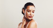 © KayExam/peopleimages.com - Skincare, cosmetics and woman with beauty, shine and dermatology on white studio background. Person, mockup space or model with glow, acne treatment and grooming with wellness, smooth or healthy skin