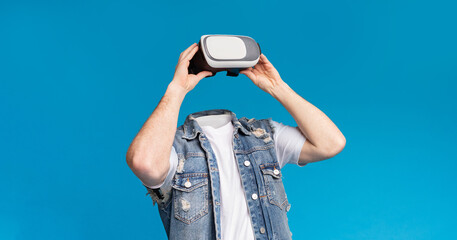 Poster - A person engages with a virtual reality headset, immersed in a world of modern technology. The background is a vibrant blue, emphasizing the innovative gadget in use.