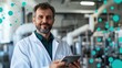 © Endin - Scientist smiling with tablet in lab