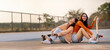 © RedcupStudio - Happy young Asian girls with classmate students having fun skateboarding together in skate park, Friend happiness moment, Widescreen with copy space.
