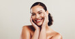 © KayExam/peopleimages.com - Portrait, woman and smile for skincare in studio of natural beauty, facial treatment and dermatology glow. Female person, happy and cosmetics of self care, shine results and space on white background