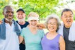 © Rawpixel.com - Group of diverse seniors smiling outdoors. Happy seniors enjoying a sunny day. Elderly friends with towels, smiling and relaxed in a park setting. Active diverse senior people exercise.