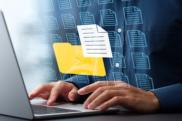 Fototapete - Document management system DMS and archival storage. Folder icon and file icons. Businessman using laptop computer for saving and retrieving digital documents.
