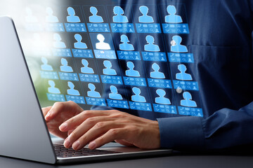 Leinwandbilder - Customer management system CMS and information database. Accessing client data collection system. Businessman typing on laptop computer keyboard at desk in office.