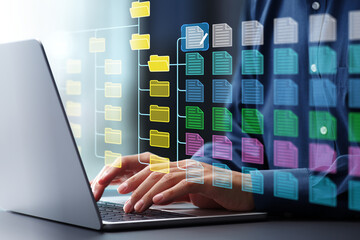 Fototapete - Document management system DMS and version control.Folder structure and classification system. File and folder icons. Businessman using laptop computer.