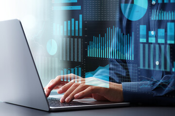 Fototapete - Business management analysis using spreadsheet software. Financial graphs and table calculations. Businessman using laptop computer to analyze business conditions.