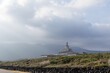 © d3_plus - 日本三大廃墟の一つ、旧八丈オリエンタルリゾートホテル。背後には巨大な八丈富士、三原山が見える。現在では著名な廃墟として、好事家に人気になっている。基本的に立ち入り禁止。また各所が崩壊しているため危険でもある。写真は外部から撮影したもの。東京都伊豆諸島八丈島-2025年