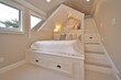 © kornc - A cozy, stylish loft bedroom featuring a built-in bed with storage, soft lighting, and a staircase leading to elevated space, perfect for a compact living area.