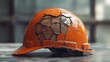 © EUT - Cracked orange hard hat on surface shows heavy impact, broken protection. Safety equipment reminder, also illustrates workplace accidents and prevention.