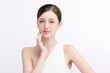 © kitthanes  - A beautiful young woman with clean, fresh skin against a white background. Skincare, facial treatment, cosmetology, beauty, and spa. An elegant portrait of an woman.
