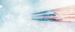 © Wittawit - modern train travels through snowy landscape, creating sense of speed and motion. scene captures beauty of winter, with soft snowflakes falling around sleek train