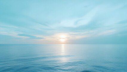 bright sun creating a dazzling reflection path across calm blue water under a vast pale blue sky wit