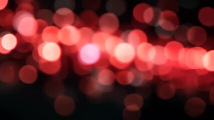 Wall Mural - abstract red bokeh light effect background for holiday season with defocused circles on dark backdro