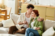 © LIGHTFIELD STUDIOS - Young couple cherishes intimate moments together in their cozy living room at home