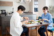 © kazoka303030 - A young Japanese couple enjoying a holiday lunch