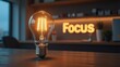 © taezhniya31 - A glowing light bulb with the word 'FOCUS' illuminated, symbolizing creativity and clarity in a modern workspace