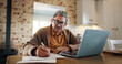 © CC/peopleimages.com - Budget, laptop and senior man with documents in home for asset management, life insurance application or taxes. Financial planning, person and writing on paperwork for retirement funds or investment