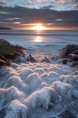 Wall Mural - frosty beach sunrise. icy textures meet ocean waves
