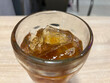 © Nugi - Iced Beverage Filled With Ice Cubes Sits on a Table in a Casual Dining Setting