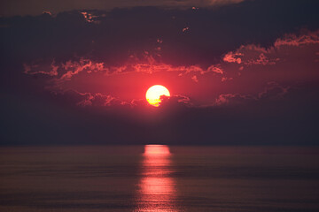 Wall Mural - beautiful sunrise with sun track on ocean