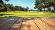 © Rhony - Empty wooden table with blurred golf course background.