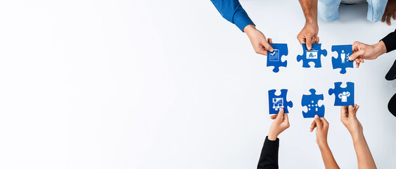 Aufkleber - A team of professionals collaborates to assemble puzzle pieces, representing the strategic planning and problem-solving process in a business environment. Amity