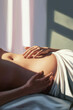 © VGX Ultra - Serene Moment of Anticipation: Hands Cradling a Beautifully Curved Pregnancy Belly in Soft Natural Light