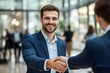 © li - Success in negotiation. Smiling confident young businessman in formal suit handshake make deal with partner on stakeholders group meeting. Happy job seeker shake employers hand getting job. Copy space