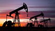 © Mehdi - Oil Pumps Silhouettes Against A Vivid Sunset Sky, Industrial Landscape. Energy Production At Dusk. Resource Extraction, Powerful Imagery. Evening Sky Glow.