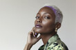 © Moriarty - A confident and elegant woman with white hair and violet highlights, reflecting empowerment, mature fashion, and timeless beauty. Her radiant expression and modern style are ideal for fashion, wellnes