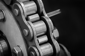 Aufkleber - A close up of a chain link with a lot of bolts and nuts. The chain is made of metal and has a lot of detail