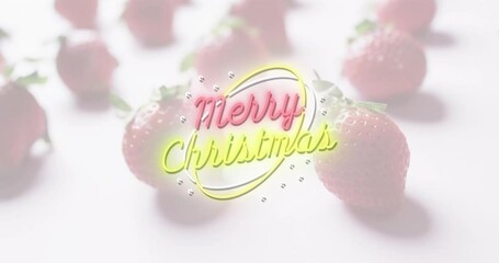 Wall Mural - glowing merry christmas text over strawberries animation on light background