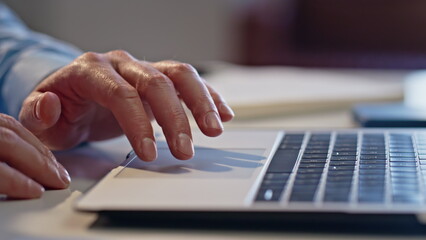 Wall Mural - Man fingers swiping touchpad computer in light office closeup. Guy hands working