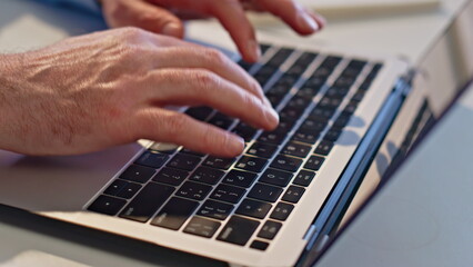 Wall Mural - Hands typing laptop keyboard closeup. Manager working computer answering email