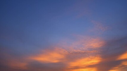 Wall Mural - 4K: A timelapse video, where the burning and shining sunset sky displays a romantic mix of colorful. Time lapse. Peaceful background.
