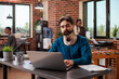 © DC Studio - Focused businessman with neck support, sitting at desk and adapting to work life challenges at startup company. Injured male employee with medical brace using laptop and navigating daily office tasks.