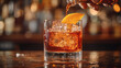 © Prokopchuk - Bartender pouring Negroni over ice in short glass