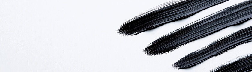 Wall Mural - Black brush strokes create clean and realistic look on white background, perfect for artistic designs