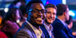 © ScottR - Portrait Of Smiling Man With Glasses During Conference With Blue And Black Backdrop