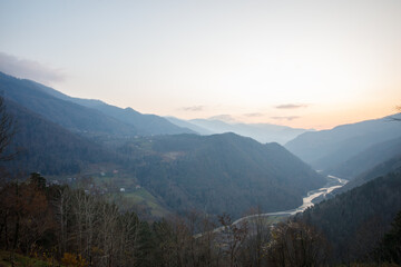 Wall Mural - beautiful sunny landscape of mountains, river and trees in variaki, georgia