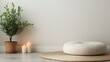 © Cherrin - Healthy lifestyle choices for better well-being concept. Cozy interior scene with a plant, candles and a round cushion on the floor.