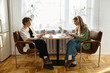 © Bliss - Loving couple enjoys cozy time together while working and relaxing in their modern home