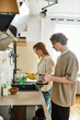 © Bliss - Loving couple sharing moments in their cozy kitchen while preparing tea together