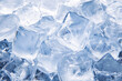 © lashkhidzetim - pile of ice cubes with a blue tint. The ice cubes are all different sizes and are scattered throughout the image