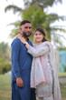 © Husnain - Happy young Pakistani Indian couple posing together