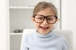 © New Africa - Little girl trying glasses at ophthalmologist office, space for text