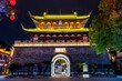 © robertharding - Baoning Gate, reconstructed 2004, at night, housing the drum tower in Guzicheng, ancient city of Jinhua City, Zhejiang Province