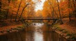 © Stock - Serene autumn landscape featuring a wooden bridge over a tranquil river surrounded by vibrant foliage